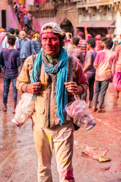 The man wearing a blue scarf